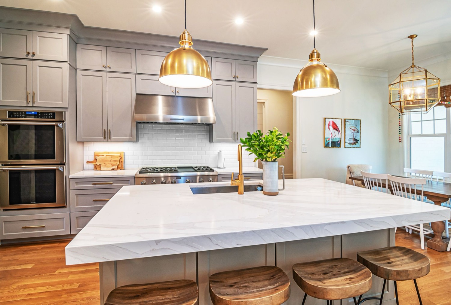 Pendants centred over an island with downlights on their own way — the sort of scheme that wants planning before the ceiling goes on.
